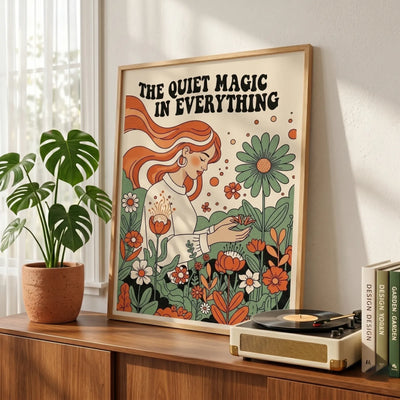 Vintage 70s style postcard poster titled The Quiet Magic in Everything displayed on a wooden shelf in a sunlit room