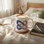 11oz 325ml ceramic mug dimensions compared next to a book and glasses for real-world size visualization