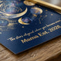 Macro shot of the gold foil lettering and satin finish of the Mama Est 2026 print