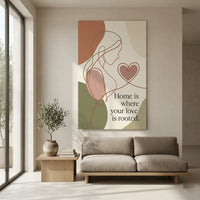 Modern open-plan living room with natural light from large window to the left, neutral color palette, sand-textured wall featuring massive, unframed 24x36 inch Mother's Day roots love poster derived from image_0.png with minimalist abstract line art maternal embrace and unique quote 'Home is where your love is rooted.' hanging prominently above a low-profile taupe linen sofa