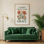 Large 24x36 Mother's Day poster hanging above a stylish emerald green sofa, showing how a statement piece transforms the room