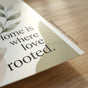 Macro photograph showing the distinct, subtle texture of the bright white 'LexJet 9.5 Mil Premium Satin Paper' corner section of the Mother's Day roots love poster, highlighting sharp fine paper grain and saturated ink colors without glare. Small text overlay: 'Premium 9.5 Mil Satin - High Res Print