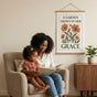 A cozy reading nook in an American home showing a 16x24 Mother's Day poster as a thoughtful gift for mom