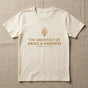 Flat-lay close-up of durable 5.3 oz cotton t-shirt with gold screen print on linen