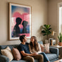 Lifestyle shot of a framed 00s Baby poster hanging in a cozy modern living room above a young couple