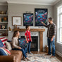 Scale reference for 24x36 and 18x24 inch soccer tournament host cities posters in a family living room